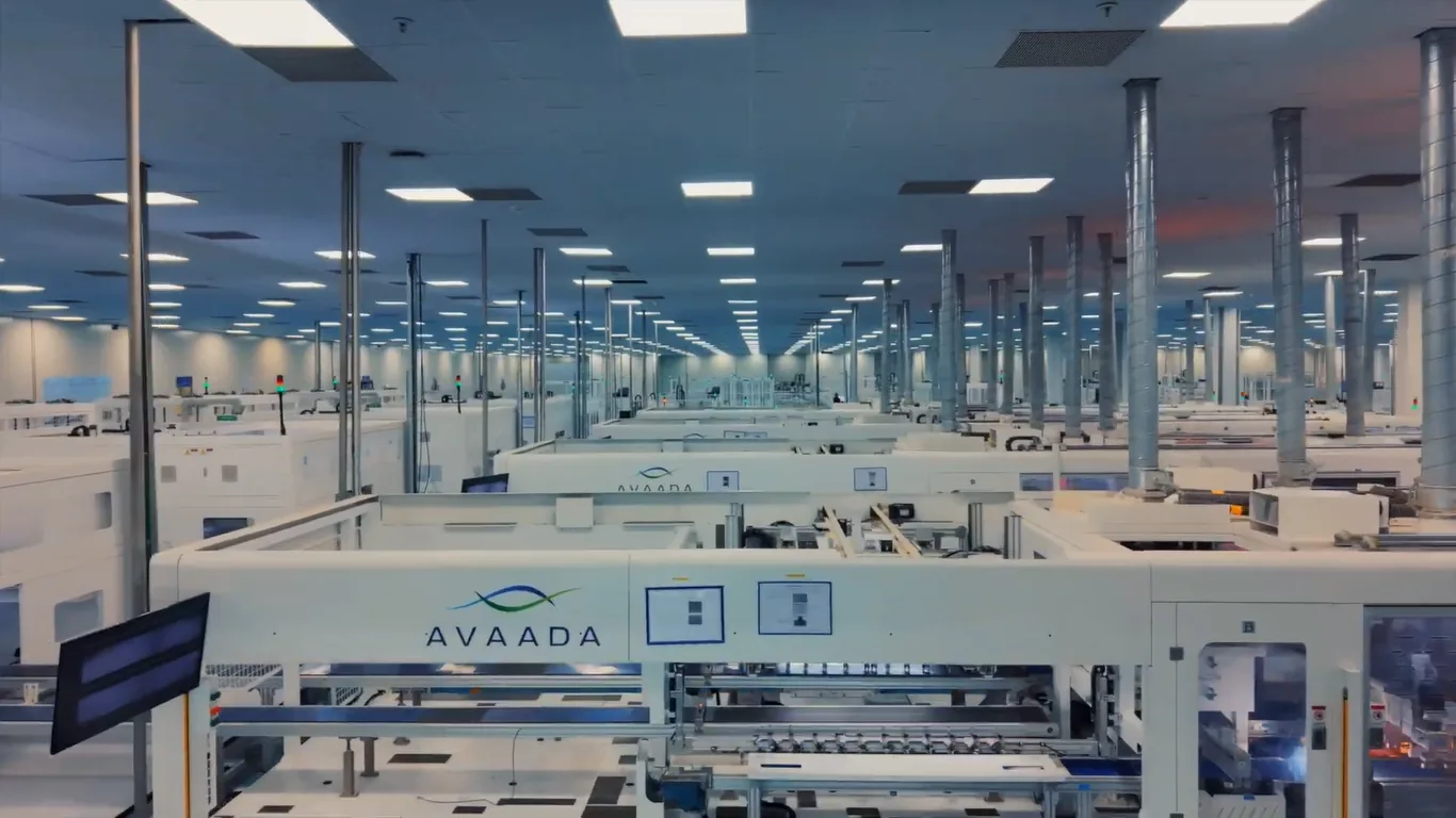 Rows of Avaada-branded automated machines on the solar manufacturing floor of the Super Factory